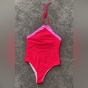Pink lily one piece cheeky. Size medium.